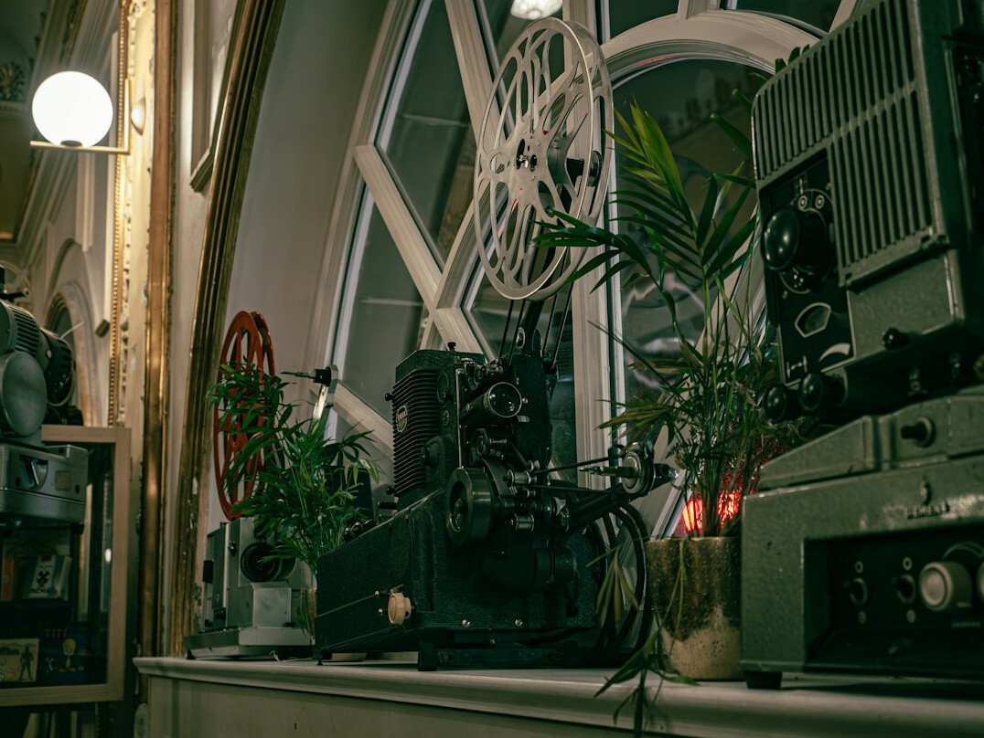 Television control room with multiple broadcast monitors and a mixing desk